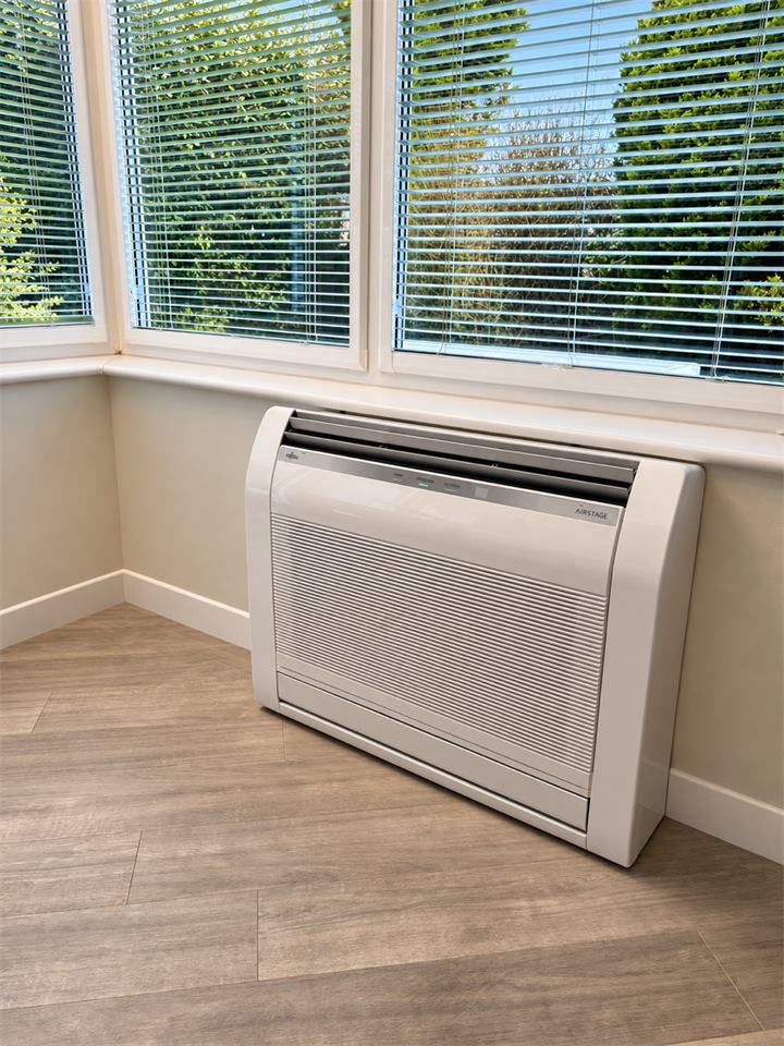Fujitsu floor console fitted below the windows of a conservatory in Northwich
